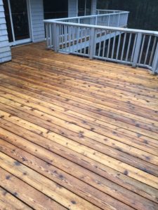 Dependable Deck Cleaning For Your Michigan Property Your deck is a considerable investment. It's also a smart and comfortable way to extend your living space. You enjoy the outdoors, family time, gatherings, parties, and cook-outs on your deck. It's important to keep it safe, hygienic, and visually appealing for optimum enjoyment. Because your deck is exposed to outdoor elements year-round, debris, dirt, and algae can build up quickly. This accumulation mars the beauty of your outdoor recreational space. It also presents safety hazards - slips, trips, and falls. That's why regular deck washing is an essential part of your deck maintenance regimen. Why Hire Professional Cleaners? Your deck is outdoors, and you own a garden hose. Why do you need to hire a cleaning company? Well, a hose isn’t going to cut it on mold, mildew, algae, and built-up dirt and sludge. You need pressurized water to blast away that grime. But before you rush out and rent a pressure washer, be sure you understand all the variations of this sensitive, yet powerful equipment. You must select the right pressure/pump psi, use the proper pressure nozzles, and apply a constant, steady hand while cleaning. Wood, concrete, and painted surfaces are all washed differently. The wrong choices and applications can cause damage. You can mar the finish, erode paint, disfigure the wood, mark up and etch the surfaces, and do other damage. Applying the wrong cleaning chemicals and detergents carry potential dangers, as well. In addition to the damage they might do to your deck, they can harm your pets and vegetation. At the very least, they simply won’t do the job. Avoid all these problems and secure a clean deck with the skilled exterior ProWash cleaners at Roof Renew of Michigan! Thorough Deck Cleaning Services Our team is prepared to clean with the equipment, cleaning solutions, and skill you desire. Our cleaners are prompt, courteous, professional, and thorough. We respect your property, privacy, and time. We do the job quickly, with minimum disruption to your day. But we never cut corners or shirk our responsibilities. As a matter of fact, we carefully remove vegetation and debris (sticks, leaves, needles, etc.) from your deck before treating the surface. We also clean up any debris after we complete the job. View some before and after deck cleaning photos for a visual representation of the difference our deck cleaning services can make. Then call us at 231-548-2008 to discuss your project. You can rely on Roof Renew of Michigan for thorough cleaning with beautiful results!